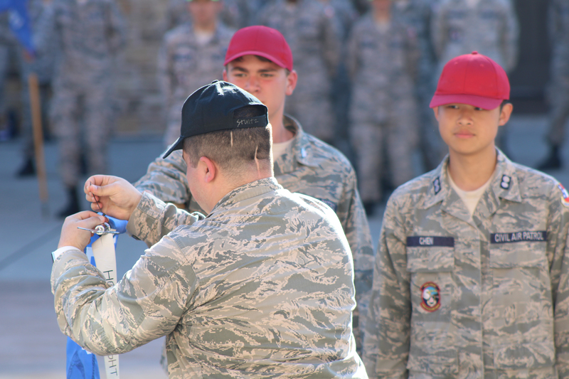 Cadets recieving a ribbon for their guidon.